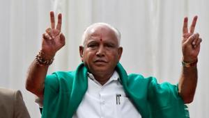 Bharatiya Janata Party (BJP) leader B. S. Yeddyurappa flashes the victory sign after taking oath as Chief Minister of the southern state of Karnataka inside the governor's house in Bengaluru, India, May 17, 2018.(Reuters Photo)