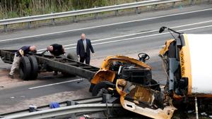 Police investigators look at the wreckage of a school bus on Interstate 80 following an accident with a dump truck in Mount Olive Township, New Jersey, US.(Reuters Photo) Police investigators look at the wreckage of a school bus on Interstate 80 following an accident with a dump truck in Mount Olive Township, New Jersey, US.(Reuters Photo)