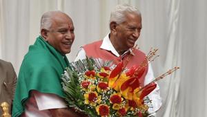 Karnataka chief minister BS Yeddyurappa being greeted by governor Vajubhai Vala after administering oath of office to him, at a ceremony at Raj Bhavan in Bengaluru on Thursday.(Arijit Sen/HT Photo) Karnataka chief minister BS Yeddyurappa being greeted by governor Vajubhai Vala after administering oath of office to him, at a ceremony at Raj Bhavan in Bengaluru on Thursday.(Arijit Sen/HT Photo)