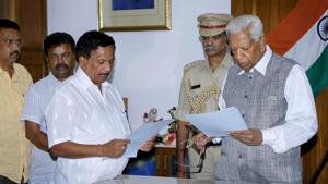 BJP legislator KG Bopaiah (left) takes oath as pro-tem Speaker ahead of the floor test in Bengaluru on Friday.(PTI Photo) BJP legislator KG Bopaiah (left) takes oath as pro-tem Speaker ahead of the floor test in Bengaluru on Friday.(PTI Photo)