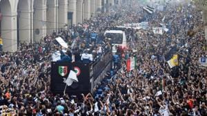 Juventus players celebrate on an open bus after clinching the Serie A title for a record extending seventh successive time in Turin on Saturday.(AP) Juventus players celebrate on an open bus after clinching the Serie A title for a record extending seventh successive time in Turin on Saturday.(AP)