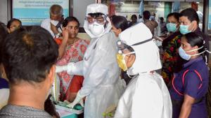 Family members of the patients admitted at the Kozhikode Medical College wear safety masks after the 'Nipah' virus outbreak, in Kozhikode.(PTI Photo) Family members of the patients admitted at the Kozhikode Medical College wear safety masks after the 'Nipah' virus outbreak, in Kozhikode.(PTI Photo)