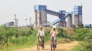 Men ride their bicycles in front of the Bhushan Steel plant in the eastern Indian state of Odisha(REUTERS File Photo) Men ride their bicycles in front of the Bhushan Steel plant in the eastern Indian state of Odisha(REUTERS File Photo)