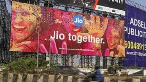 Traffic travels past a billboard for Reliance Jio Infocomm Ltd. in the Bandra area of Mumbai, India.(Bloomberg via Getty Images)