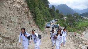 Board students rush to the examination centre walking on a hilly terrain in Uttarkashi. The state board examinations concluded on March 24 and results are awaited on May 26.(HT photo) Board students rush to the examination centre walking on a hilly terrain in Uttarkashi. The state board examinations concluded on March 24 and results are awaited on May 26.(HT photo)