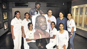 Chris Gayle with Pune’s women cricketers at the Blades of Glory museum at Sahakarnagar in Pune on Tuesday.(HT PHOTO) Chris Gayle with Pune’s women cricketers at the Blades of Glory museum at Sahakarnagar in Pune on Tuesday.(HT PHOTO)
