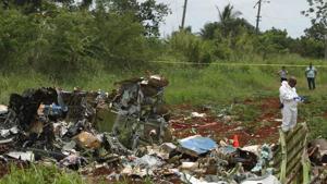 A rescue team member works at the wreckage of a Boeing 737 plane that crashed in the agricultural area of Boyeros, around 20 km (12 miles) south of Havana, shortly after taking off from Havana's main airport in Cuba, May 18, 2018. REUTERS/Alexandre Meneghini(REUTERS) A rescue team member works at the wreckage of a Boeing 737 plane that crashed in the agricultural area of Boyeros, around 20 km (12 miles) south of Havana, shortly after taking off from Havana's main airport in Cuba, May 18, 2018. REUTERS/Alexandre Meneghini(REUTERS)