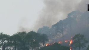 Two MI-17 helicopters of the Indian Air Force and a light utility helicopter were pressed into service to douse the fire.(ANI Photo) Two MI-17 helicopters of the Indian Air Force and a light utility helicopter were pressed into service to douse the fire.(ANI Photo)