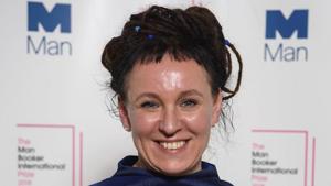 Polish author Olga Tokarczuk smiles after winning the Man Booker International prize 2018, for her book Flights, at the Victoria and Albert Museum in London.(AP) Polish author Olga Tokarczuk smiles after winning the Man Booker International prize 2018, for her book Flights, at the Victoria and Albert Museum in London.(AP)