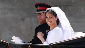 Meghan Markle and Prince Harry ride in an Ascot Landau carriage at Windsor Castle after their wedding in Windsor, Britain.(REUTERS) Meghan Markle and Prince Harry ride in an Ascot Landau carriage at Windsor Castle after their wedding in Windsor, Britain.(REUTERS)
