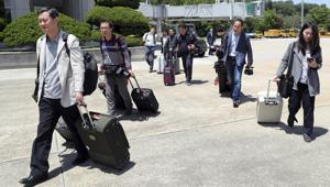 South Korean journalists walk to board a plane to leave for North Korea at Seoul Airport in Seongnam, South Korea, Wednesday, May 23, 2018.(AP) South Korean journalists walk to board a plane to leave for North Korea at Seoul Airport in Seongnam, South Korea, Wednesday, May 23, 2018.(AP)