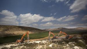 Diggers break ground for a new settlement near the Israeli settlement of Shilo, in the West Bank.(AP File Photo) Diggers break ground for a new settlement near the Israeli settlement of Shilo, in the West Bank.(AP File Photo)