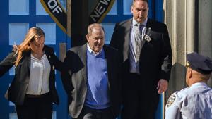 Harvey Weinstein is loaded into an unmarked vehicle while leaving the first precinct of the New York City Police Department after turning himself to authorities following allegations of sexual misconduct.(AP Photo) Harvey Weinstein is loaded into an unmarked vehicle while leaving the first precinct of the New York City Police Department after turning himself to authorities following allegations of sexual misconduct.(AP Photo)