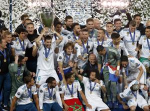 Real Madrid's Nacho lifts the trophy after winning the Champions League Final soccer match between Real Madrid and Liverpool at the Olimpiyskiy Stadium in Kiev, Ukraine.(AP Photo) Real Madrid's Nacho lifts the trophy after winning the Champions League Final soccer match between Real Madrid and Liverpool at the Olimpiyskiy Stadium in Kiev, Ukraine.(AP Photo)