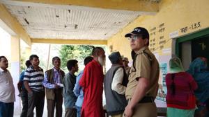 Voters wait for their turn at a polling booth in Tharali assembly constituency on Monday.(HT Photo) Voters wait for their turn at a polling booth in Tharali assembly constituency on Monday.(HT Photo)