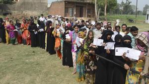 Burqa-clad women, along with other voters, show their voter identity cards as they wait to cast thier votes for Noorpur Assembly bypolls, in Bijnor, on May28, 2018.(PTI) Burqa-clad women, along with other voters, show their voter identity cards as they wait to cast thier votes for Noorpur Assembly bypolls, in Bijnor, on May28, 2018.(PTI)