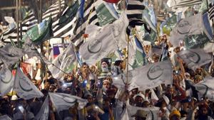 Supporters of Muttahida Majlis-e-Amal (MMA), an alliance of religious parties, waves flags during a public meeting in Lahore on May 13, 2018, ahead of the elections.(AFP) Supporters of Muttahida Majlis-e-Amal (MMA), an alliance of religious parties, waves flags during a public meeting in Lahore on May 13, 2018, ahead of the elections.(AFP)