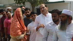 UP minister Suresh Rana (3rd in row) outside a polling booth in Kairana on Monday.(HT/Sunil Sharma) UP minister Suresh Rana (3rd in row) outside a polling booth in Kairana on Monday.(HT/Sunil Sharma)