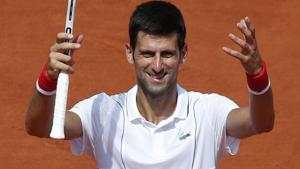 Novak Djokovic celebrates after winning his French Open second round match against Jaume Munar.(AP) Novak Djokovic celebrates after winning his French Open second round match against Jaume Munar.(AP)
