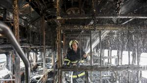A fire-fighter douses the fire inside the coach of a train parked at Chhatrapati Shivaji Maharaj Terminus railway yard in Mumbai on Tuesday.(KUNAL PATIL/ HT PHOTO) A fire-fighter douses the fire inside the coach of a train parked at Chhatrapati Shivaji Maharaj Terminus railway yard in Mumbai on Tuesday.(KUNAL PATIL/ HT PHOTO)