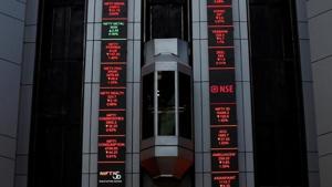 An elevator travels next to electronic boards displaying stock figures at the National Stock Exchange (NSE) building in Mumbai.(Reuters File Photo) An elevator travels next to electronic boards displaying stock figures at the National Stock Exchange (NSE) building in Mumbai.(Reuters File Photo)
