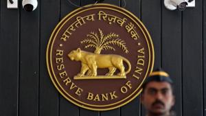 A security personnel member stands guard at the entrance of the Reserve Bank of India (RBI) headquarters in Mumbai.(REUTERS File Photo) A security personnel member stands guard at the entrance of the Reserve Bank of India (RBI) headquarters in Mumbai.(REUTERS File Photo)