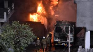 Firefighters attempt to douse a massive fire that broke out at a plastic and rubber warehouse near a school at south Delhi’s Malviya Nagar in New Delhi.(Sanchit Khanna/HT Photo) Firefighters attempt to douse a massive fire that broke out at a plastic and rubber warehouse near a school at south Delhi’s Malviya Nagar in New Delhi.(Sanchit Khanna/HT Photo)