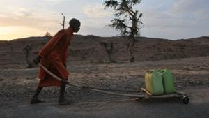 A file photo of a priest carrying water for a temple in Bundelkhand area near Prithvipur in Madhya Pradesh. Several regions of Madhya Pradesh, including Bundelkhand, has been facing acute water shortage because of scanty rainfall in last monsoon and an almost dry winter(Mujeeb Faruqui/HT File Photo) A file photo of a priest carrying water for a temple in Bundelkhand area near Prithvipur in Madhya Pradesh. Several regions of Madhya Pradesh, including Bundelkhand, has been facing acute water shortage because of scanty rainfall in last monsoon and an almost dry winter(Mujeeb Faruqui/HT File Photo)