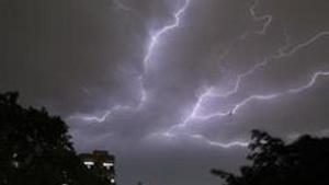 Lightning strikes over residential apartments during a thunderstorm on the outskirts of New Delhi on May 2, 2018.(AFP File Photo) Lightning strikes over residential apartments during a thunderstorm on the outskirts of New Delhi on May 2, 2018.(AFP File Photo)
