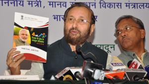 Union HRD minister Prakash Javadekar shows a brochure on works done by the Modi government in past four years, at a press conference in Dehradun on Friday.(Vinay Santosh Kumar/HT Photo) Union HRD minister Prakash Javadekar shows a brochure on works done by the Modi government in past four years, at a press conference in Dehradun on Friday.(Vinay Santosh Kumar/HT Photo)
