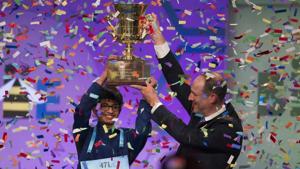Karthik Nemmani, 14, from McKinney, Texas, is presented with the Scripps National Spelling Bee trophy by Adam Symson, president and CEO, E.W. Scripps Company, after he won the bee, in Oxon Hill, Maryland, US, on Thursday.(AP) Karthik Nemmani, 14, from McKinney, Texas, is presented with the Scripps National Spelling Bee trophy by Adam Symson, president and CEO, E.W. Scripps Company, after he won the bee, in Oxon Hill, Maryland, US, on Thursday.(AP)