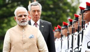 Prime Minister Narendra Modi inspects a guard of honour with Singapore’s Prime Minister Lee Hsien Loong at the Istana in Singapore on June 1.(Reuters photo) Prime Minister Narendra Modi inspects a guard of honour with Singapore’s Prime Minister Lee Hsien Loong at the Istana in Singapore on June 1.(Reuters photo)