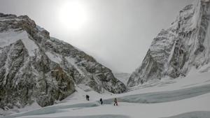 File photo of mountaineers walking near a camp of Mount Everest.(AFP photo) File photo of mountaineers walking near a camp of Mount Everest.(AFP photo)
