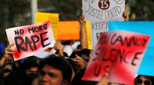 People hold placards as they participate in a protest over crimes against women.(Reuters File Photo) People hold placards as they participate in a protest over crimes against women.(Reuters File Photo)