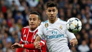 Real Madrid's Marco Asensio (in white) in action with Bayern Munich's Thiago Alcantara.(REUTERS) Real Madrid's Marco Asensio (in white) in action with Bayern Munich's Thiago Alcantara.(REUTERS)