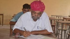Elderly villagers appear for the class 8 examination at the Kota Open University in Barmer on Tuesday.(HT Photo) Elderly villagers appear for the class 8 examination at the Kota Open University in Barmer on Tuesday.(HT Photo)