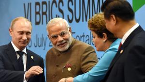 Prime Minister Narendra Modi (centre) poses with Russian President Vladimir Putin (extreme left), Chinese premier Xi Jinping (extreme right) and former Brazilian President Dilma Rousseff at the VI BRICS Summit in July 2014.(AFP) Prime Minister Narendra Modi (centre) poses with Russian President Vladimir Putin (extreme left), Chinese premier Xi Jinping (extreme right) and former Brazilian President Dilma Rousseff at the VI BRICS Summit in July 2014.(AFP)