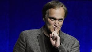 Quentin Tarantino, writer/director of the upcoming film Once Upon a Time in Hollywood, gestures to the audience during the Sony Pictures Entertainment presentation at CinemaCon 2018.(Chris Pizzello/Invision/AP) Quentin Tarantino, writer/director of the upcoming film Once Upon a Time in Hollywood, gestures to the audience during the Sony Pictures Entertainment presentation at CinemaCon 2018.(Chris Pizzello/Invision/AP)