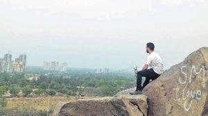 The modest cluster of rocks called Gwal Pahari gives a realistic picture of the world that must have existed here before Gurugram.(HT Photo)