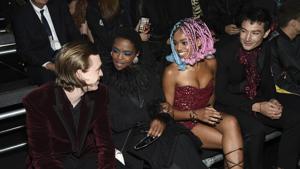 Actor Caleb Landry Jones, singer Lauryn Hill, Selah Marley and actor Ezra Miller, from left, attend the Saint Laurent Spring/Summer 2019 Menswear Collection at Liberty State Park.(Evan Agostini/Invision/AP)