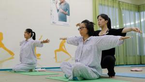 New mothers doing yoga exercises under the instruction of an instructor at the Lake Malaren International Postpartum Care Centre in Shanghai.(AFP) New mothers doing yoga exercises under the instruction of an instructor at the Lake Malaren International Postpartum Care Centre in Shanghai.(AFP)