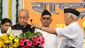 Former president Pranab Mukherjee speaks as Rashtriya Swayamsevak Sangh (RSS) chief Mohan Bhagwat adjusts the microphone during the closing ceremony of Tritiya Varsha Sangh Shiksha Varg, an (RSS) event to mark the conclusion of a three-year training camp for swayamsevaks, Nagpur, June 7, 2018(PTI) Former president Pranab Mukherjee speaks as Rashtriya Swayamsevak Sangh (RSS) chief Mohan Bhagwat adjusts the microphone during the closing ceremony of Tritiya Varsha Sangh Shiksha Varg, an (RSS) event to mark the conclusion of a three-year training camp for swayamsevaks, Nagpur, June 7, 2018(PTI)