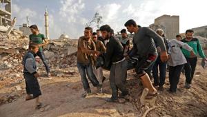 Syrian rescuers and civilians recover bodies in Zardana, in the mostly rebel-held northern Syrian Idlib province, in the aftermath of air strikes in the area, on June 8.(AFP Photo) Syrian rescuers and civilians recover bodies in Zardana, in the mostly rebel-held northern Syrian Idlib province, in the aftermath of air strikes in the area, on June 8.(AFP Photo)