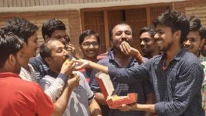 Sweets being offered at Anand Kumar’s residence in Patna. As many as 26 of the 30 students trained by famed coaching institute Super 30 have cleared the JEE-Advanced 2018 for admission to India’s premiere IITs, its founder Anand Kumar said on Sunday.(Handout image)