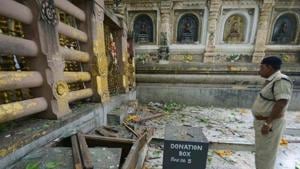 A national security guard soldier collects evidence from the site of the Mahabodhi Temple in Bodh Gaya a day after the serial blasts in 2013.(AP file photo) A national security guard soldier collects evidence from the site of the Mahabodhi Temple in Bodh Gaya a day after the serial blasts in 2013.(AP file photo)