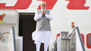Prime Minister Narendra Modi gesturing before boarding an aircraft flying to Qingdao in China to attend the annual Shanghai Cooperation Organisation (SCO) summit, in New Delhi.(AFP/ Handout photo) Prime Minister Narendra Modi gesturing before boarding an aircraft flying to Qingdao in China to attend the annual Shanghai Cooperation Organisation (SCO) summit, in New Delhi.(AFP/ Handout photo)