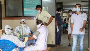 Doctors and patients wear safety masks as a precautionary measure after the 'Nipah' virus outbreak, at a Medical college, in Kozhikode.(PTI File Photo) Doctors and patients wear safety masks as a precautionary measure after the 'Nipah' virus outbreak, at a Medical college, in Kozhikode.(PTI File Photo)
