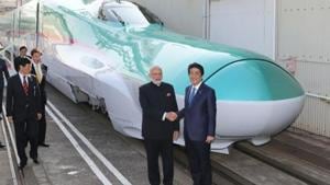 Prime Minister Narendra Modi (2nd R) and his Japanese counterpart Shinzo Abe (R) shake hands in front of a Shinkansen train during their inspection of a bullet train manufacturing plant in Kobe, Hyogo prefecture on November 12, 2016 .(AFP) Prime Minister Narendra Modi (2nd R) and his Japanese counterpart Shinzo Abe (R) shake hands in front of a Shinkansen train during their inspection of a bullet train manufacturing plant in Kobe, Hyogo prefecture on November 12, 2016 .(AFP)