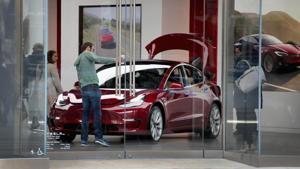 Electric-carmaker Tesla Motors announced June 12, 2018 it cut nine percent of its workforce to enhance profitability, but said the move would not affect an ambitious production ramp-up of its Model 3 sedan.(AFP Photo) Electric-carmaker Tesla Motors announced June 12, 2018 it cut nine percent of its workforce to enhance profitability, but said the move would not affect an ambitious production ramp-up of its Model 3 sedan.(AFP Photo)