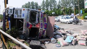 The overturned truck after it collided with the HRTC bus at Satsang Bhawan light point in Mohali on Wednesday.(HT Photo) The overturned truck after it collided with the HRTC bus at Satsang Bhawan light point in Mohali on Wednesday.(HT Photo)